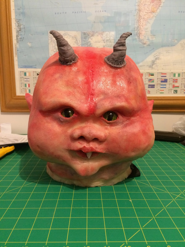 Silicone head painted with pigment
